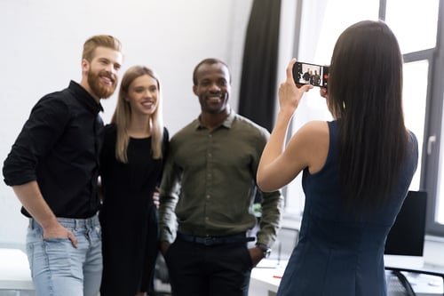 young-lady-two-young-men-being-recorded-smartphone-video